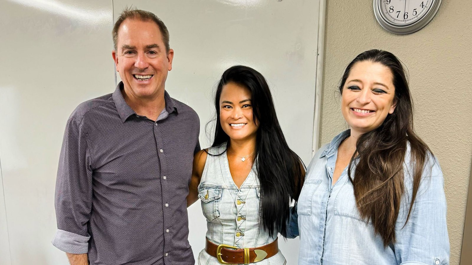 Three home care professionals smiling together during a San Antonio agency site visit, representing leadership, team culture, and connection in home care.